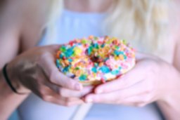 Canva - Person Holding Doughnut With Toppings.jpg